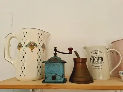 a shelf with two vases and a tea kettle at Vila Gorenka in Bled
