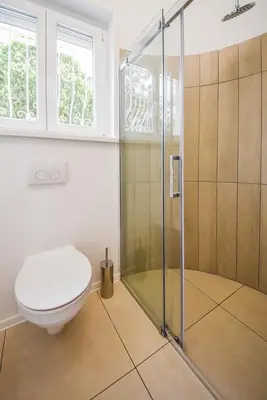 a bathroom with a toilet and a shower at Kavon Apartments in Ljubljana