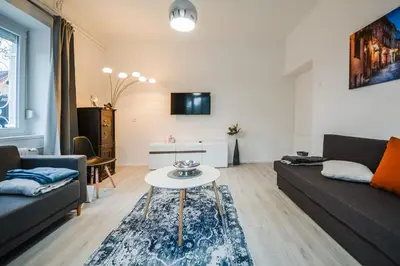 a living room with a couch and a table at Kavon Apartments in Ljubljana