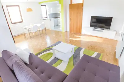a living room with a couch and a table at D&J house in Ormoz