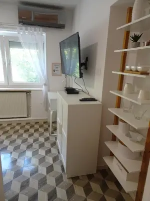 a room with a desk with a computer on top of it at Apartma Nadja with private parking in Ljubljana