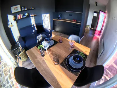 an overhead view of a table and chairs in a living room at Apartma Vita in Dobrovo