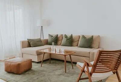 a living room with a couch and a table at Home in Bled in Bled