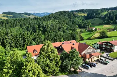 an aerial view of a house in a valley with trees at Guesthouse Smogavc in Zreče