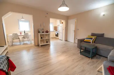 a living room with a couch and a table at Apartment Stil near Terme Paradiso in Dobova
