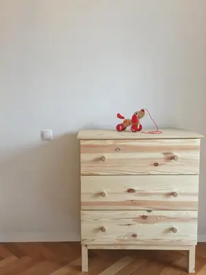 a dresser with a stuffed animal sitting on top of it at Historic Mexico Building Apartment in Ljubljana