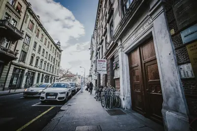 a street with cars parked on the side of the road at Kenti Residence in Ljubljana