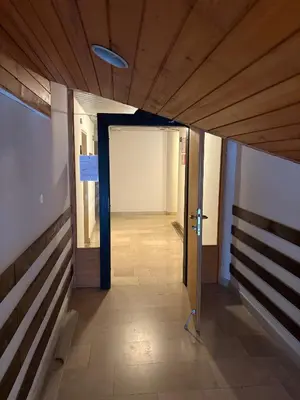 a hallway with an open door in a building at Apartma Snežko in Kranjska Gora