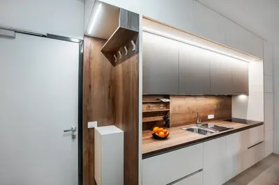 a kitchen with white cabinets and a sink at APARTMA KATKA Vila Mojca in Kranjska Gora