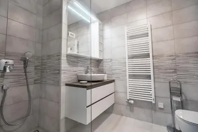 a bathroom with a sink and a shower at APARTMA KATKA Vila Mojca in Kranjska Gora