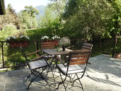 a table and chairs sitting on a patio at Hiša 109 in Kranjska Gora
