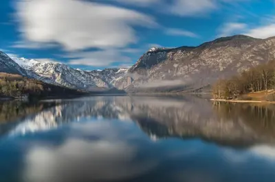 a view of a lake with mountains in the background at Apartma LINA, Encijan D-38 in Bohinj