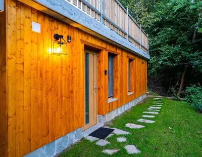 a wooden building with a door and a window at Old Boatman's House in Bled