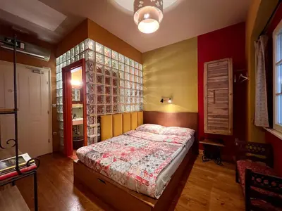 a bedroom with a bed in a room at MuziKafe - Home of Culture in Ptuj
