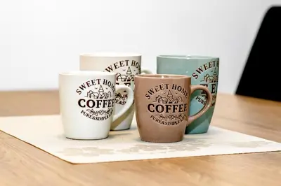 a group of coffee mugs sitting on a table at Apartmaji 