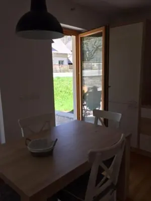 a dining room table with a bowl on top of it at Apartma Pika in Mojstrana