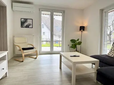 a living room with a couch and a table at Guest house Kobal in Spodnje Gorje