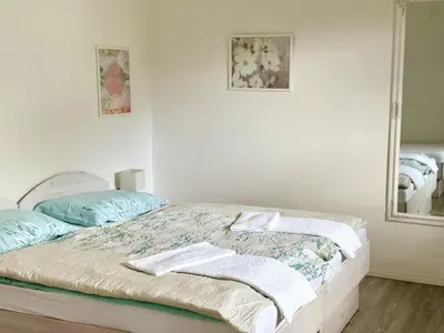 a bedroom with a bed with towels on it at Guest house Kobal in Spodnje Gorje