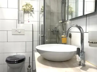 a bathroom with a white sink and a toilet at Guest house Kobal in Spodnje Gorje