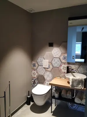 a bathroom with a toilet and a sink at B & W KRIŽ in Ajdovščina