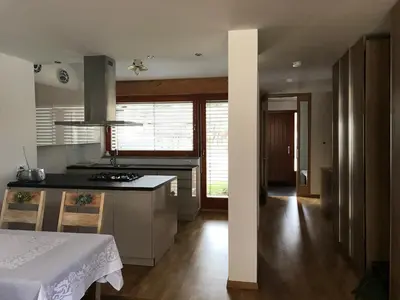 a kitchen with a stove and a counter top at Klinar - Cosy apartment with a terrace in Bled