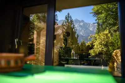 a window with a view of a mountain at Idyllic cottage in beautiful Alps in Zgornje Jezersko