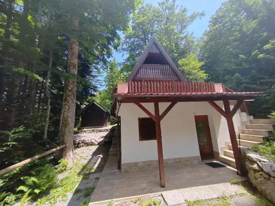 a small building with a roof on top of it at KOČA PLANIKA, SVIŠČAKI in Ilirska Bistrica