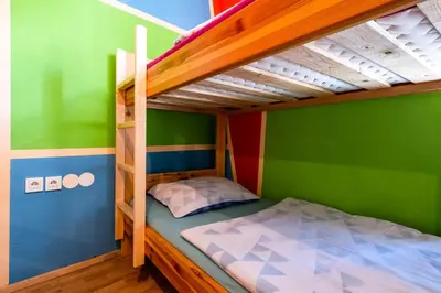 a childs bunk bed in a childs bedroom at Bled Hostel in Bled