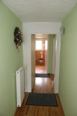an empty hallway with a toilet in a room at Apartments and rooms Brunko in Bled