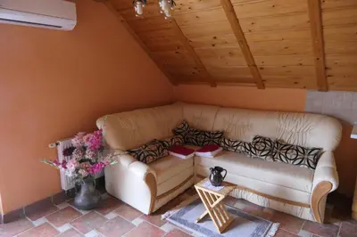 a living room with a couch and a table at Apartments and rooms Brunko in Bled