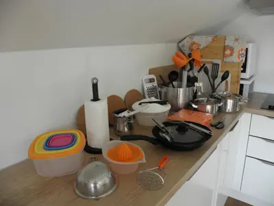 a kitchen counter with a bunch of kitchen utensils at Island View Apartment in Bled