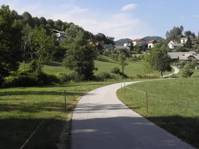 a winding road in the middle of a field at Island View Apartment in Bled