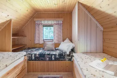 a room with two beds in a cabin at Zalin planinski raj in Goreljek