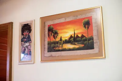 two pictures of palm trees on a wall at Apartment Tina with Seasonal Pool in Podsreda