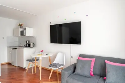 a living room with a couch and a table at Rooms Močilnik in Begunje na Gorenjskem