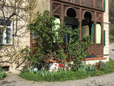 a building with a window with flowers in front of it at Vila Černe in Bled
