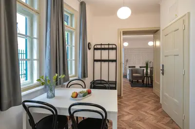 a kitchen and dining room with a table and chairs at Vila Selena in Ljubljana