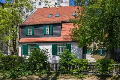 a black and white house with a red roof at Vila Selena in Ljubljana