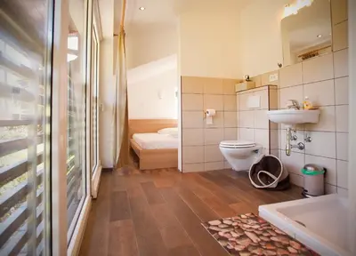 a small bathroom with a toilet and a sink at Apartments Soča in Kobarid