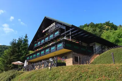 a building on top of a hill at Pod Orehi Guest House in Loče pri Poljčanah