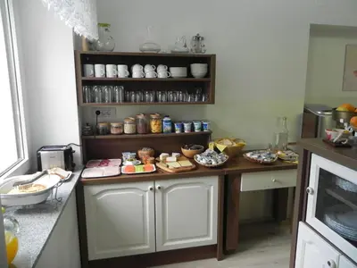 a kitchen with a table with food on it at Apartments Vesna in Bled