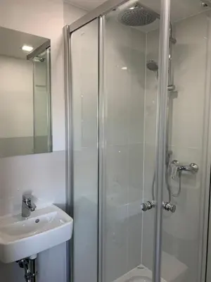 a bathroom with a shower and a sink at Apartman Decorus in Maribor