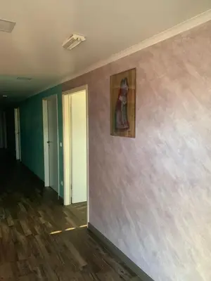 an empty room with a painting on the wall at Apartman Decorus in Maribor