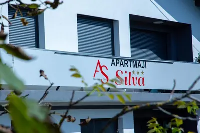 a sign on the side of a building at Apartments Silva in Ljutomer