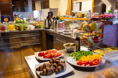 a kitchen with several plates of food on a counter at Apartments Silva in Ljutomer