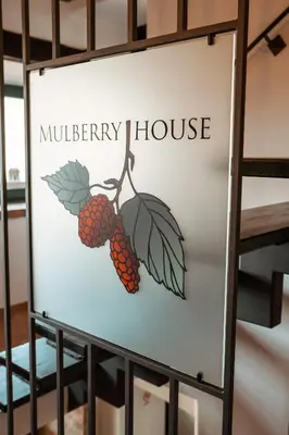 a sign for a mulberry house at Mulberry house in Šempas