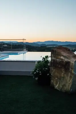 a view of a house with a plant on the roof at Bužinel Estate in Dobrovo