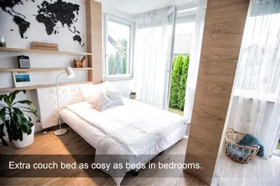 a bedroom with a bed and a window at 4* Green Heaven in centre of Bled in Bled