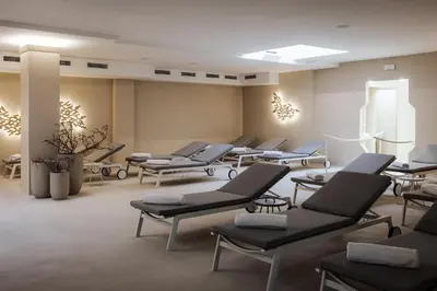 a salon with chairs and tables in a room at Hotel Slatina Superior in Rogaška Slatina