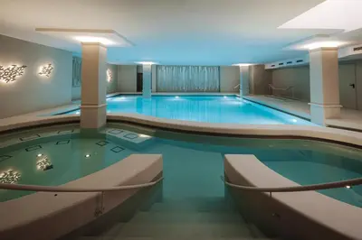 a large swimming pool in a hotel room at Hotel Slatina Superior in Rogaška Slatina